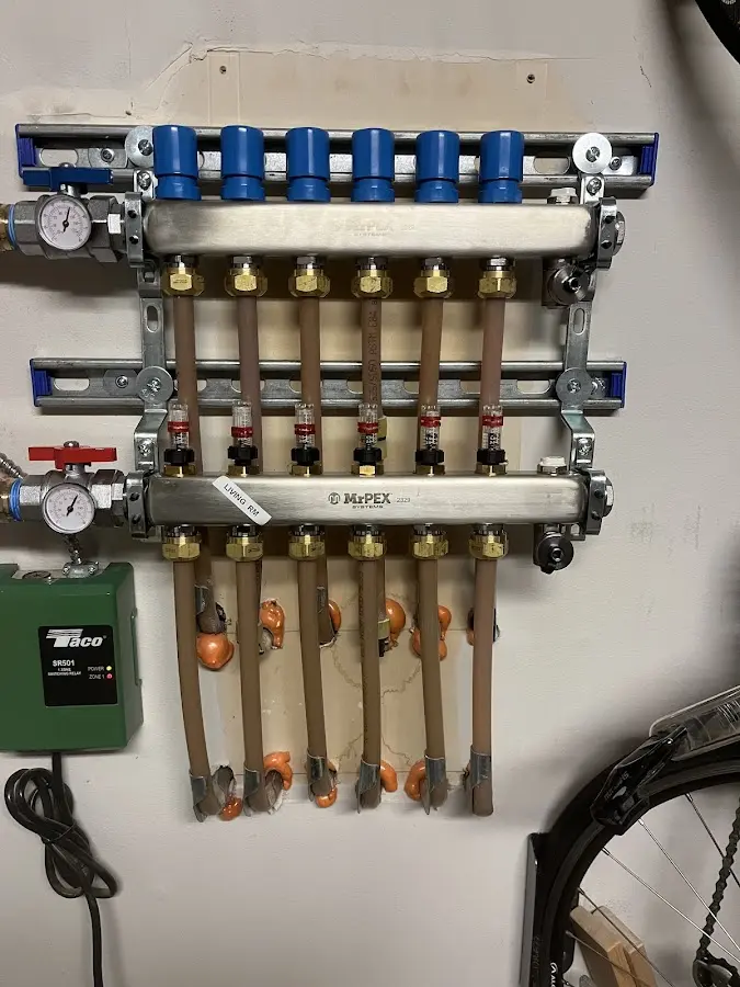 Plumber performing Gas Line Installation at a residential property in Cumberland